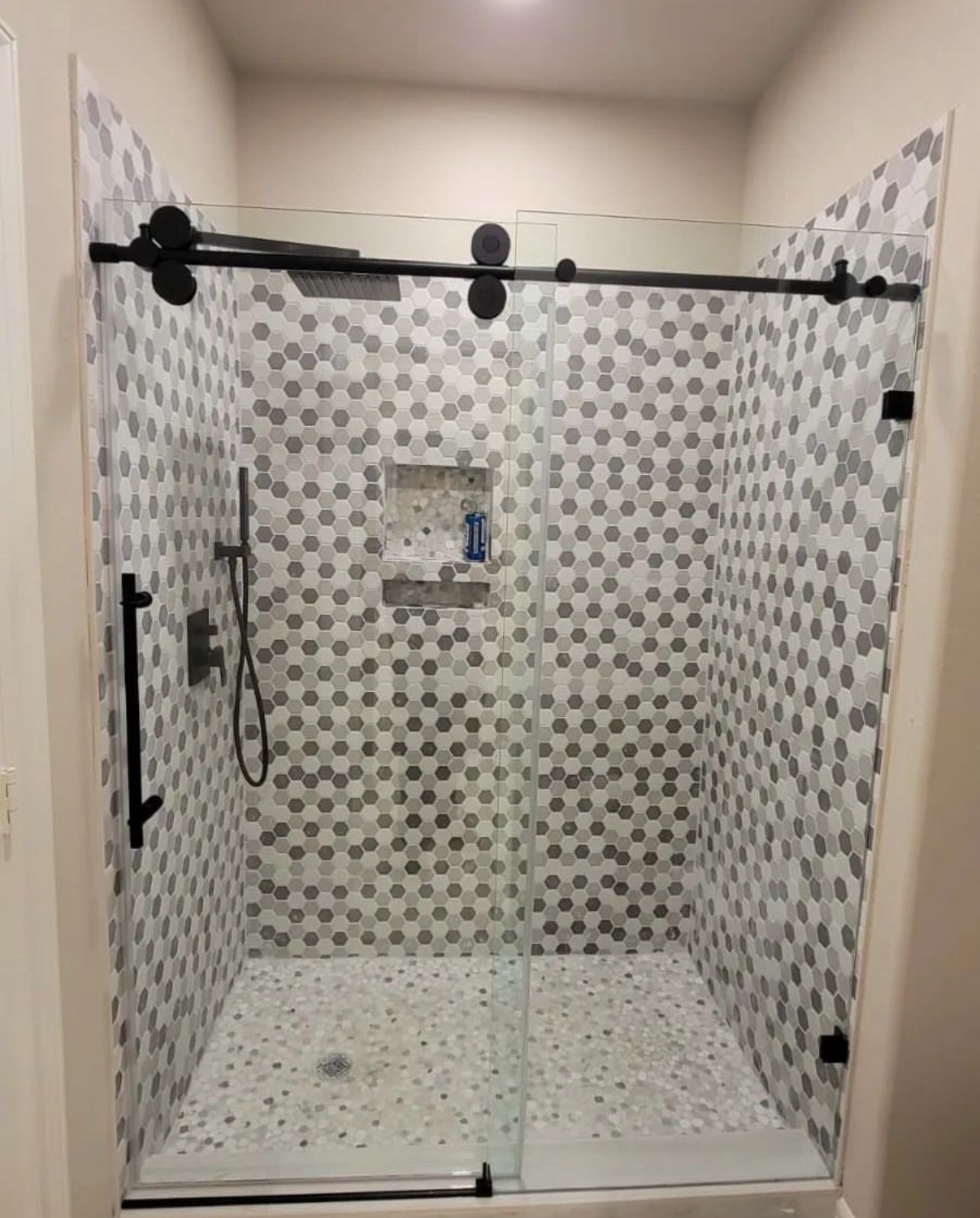 Custom glass shower enclosure installation